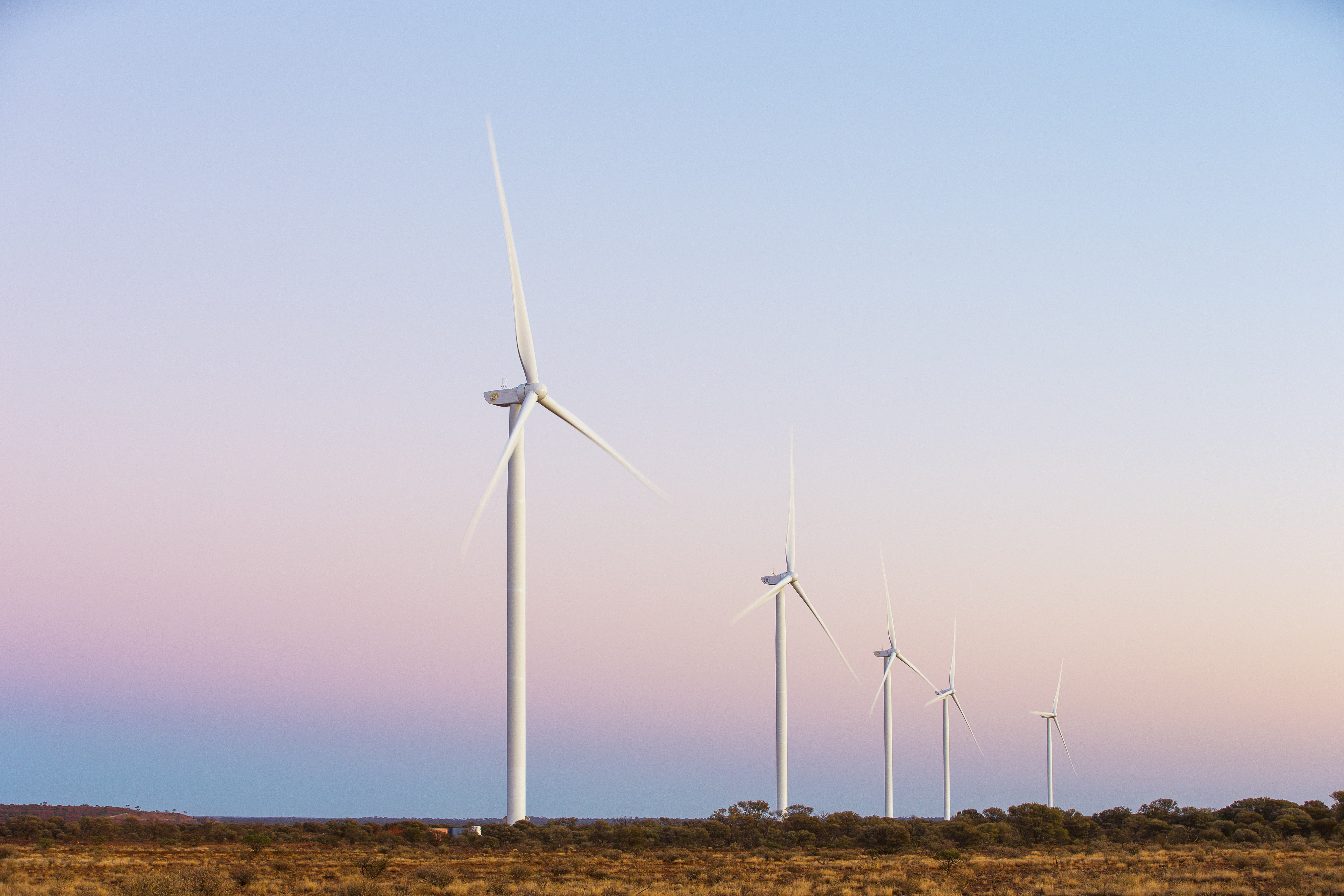 Multiple windmills in a regional landscape.